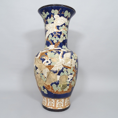 2503 - A large Chinese  blue glazed terracotta garden urn, with bird and tree decoration, H80cm