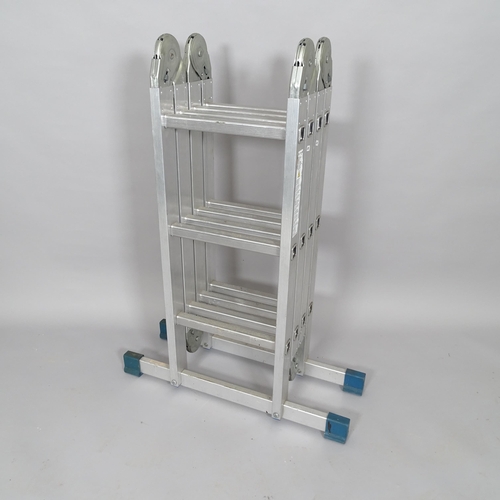 2509 - A folding metal ladder, dimensions (folded) 75cm x 100cm x 28cm