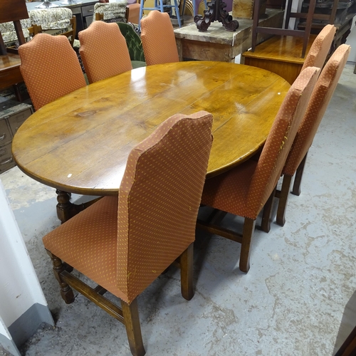 2514 - A 1930s oak oval plank-topped dining table, 200cm x 75cm x 138cm, and 7 dining chairs,