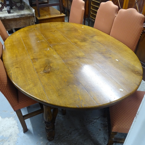 2514 - A 1930s oak oval plank-topped dining table, 200cm x 75cm x 138cm, and 7 dining chairs,