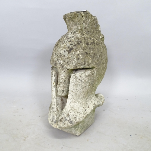 2694 - A weathered concrete garden ornament, in the form of a Corinthian helmet