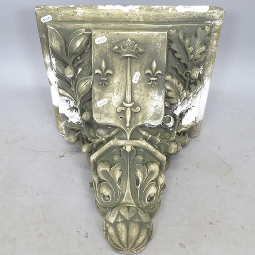 2695 - A composition garden wall bracket, 42cm x 40cm