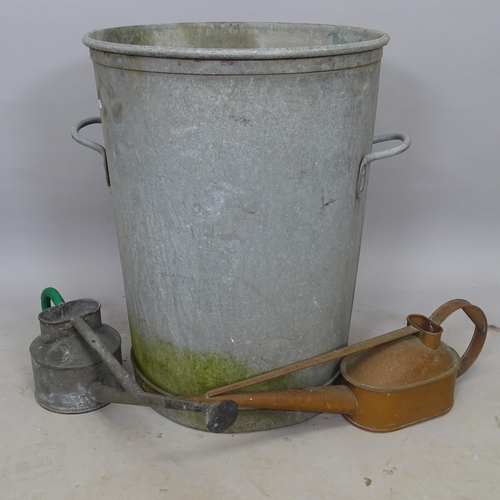 2705 - A galvanised metal waste bin, 56cm x 63cm, and a copper watering can, and a galvanised metal waterin... 