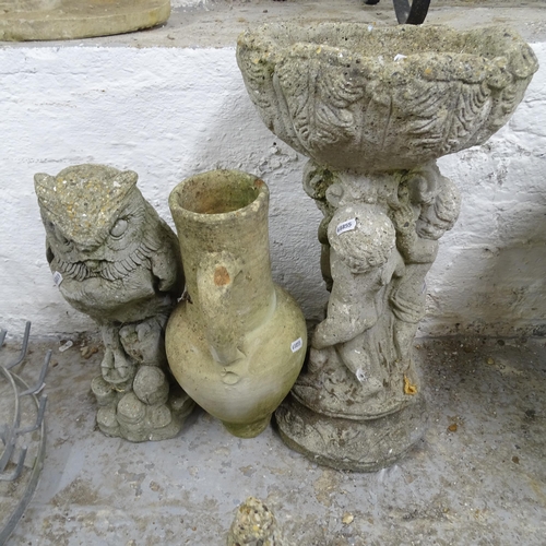 2713 - A small bird bath with figural column, 55cm, a concrete figure of an owl, 44cm, and an olive jar, 42... 