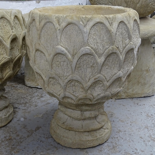 2723 - A pair of pineapple deep urns, on circular bases, 40cm x 52cm