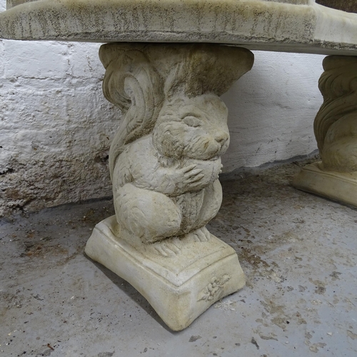 2726 - A curved concrete garden seat on squirrel plinths, 100cm x 45cm x 45cm