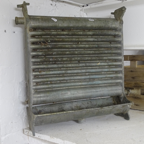 2745 - An Antique industrial heat exchanging radiator, 55cm x 52cm