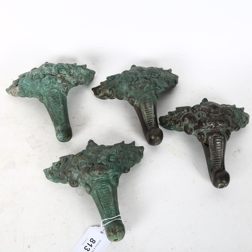 813 - A set of 4 Chinese solid cast verdigris bronze feet, height 12cm