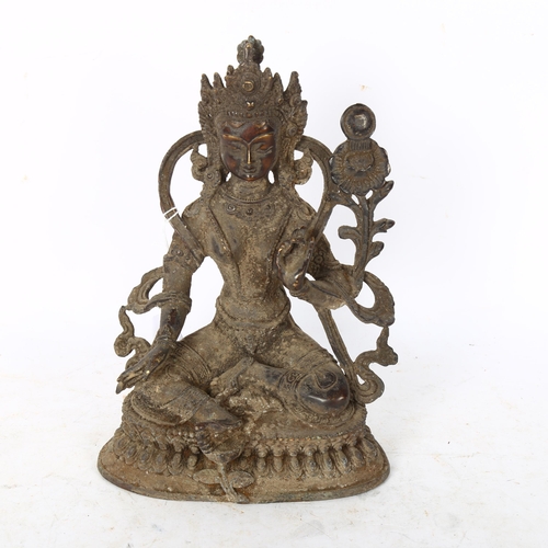 814 - A Chinese patinated bronze seated deity, on double lotus base, height 22cm