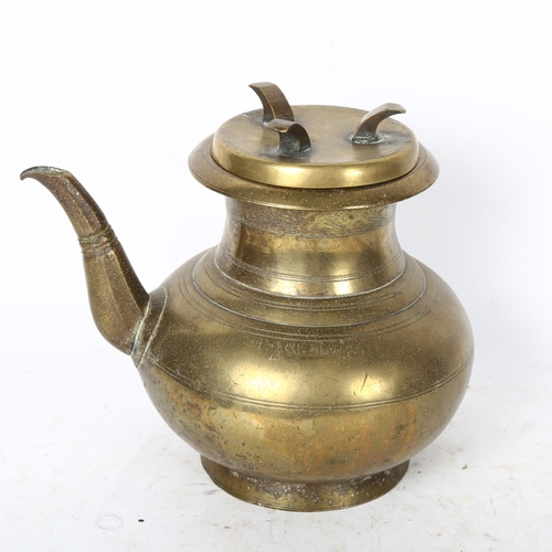 816 - A Chinese polished bronze wine ewer and cover, height 17cm