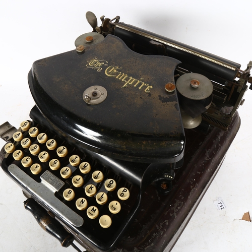 867 - An early 20th century The Empire portable typewriter, in tin case