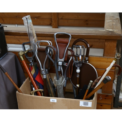 868 - A quantity of walking sticks, shooting sticks, golf club etc