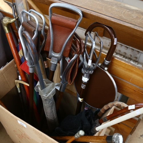 868 - A quantity of walking sticks, shooting sticks, golf club etc