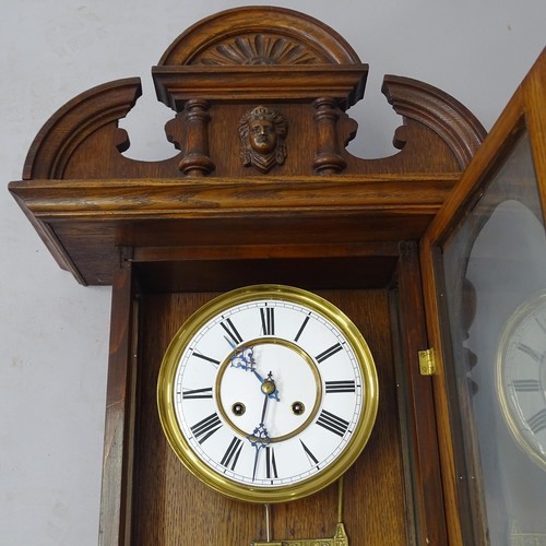 2520 - An Antique oak-cased wall clock, with key and pendulum, 45cm x 115cm x 20cm