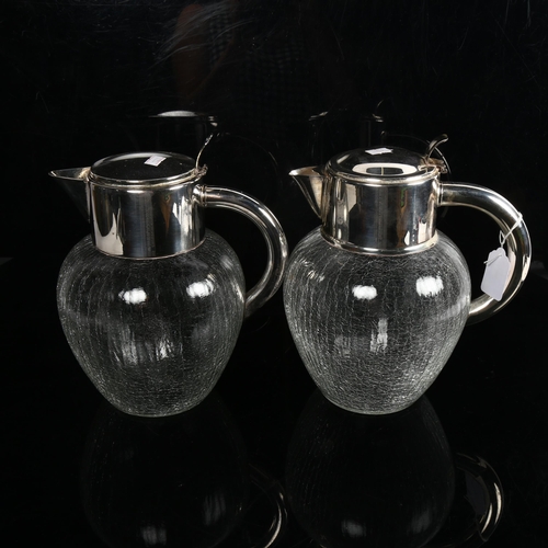 1000 - A pair of large crackle glaze water jugs with silver plated mounts