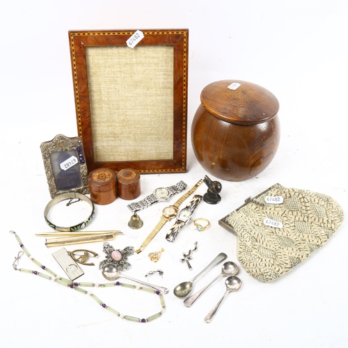 1005 - A tray containing plated spoons, wristwatches, costume jewellery, satinwood-banded frame etc