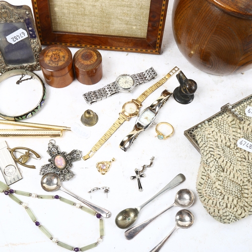 1005 - A tray containing plated spoons, wristwatches, costume jewellery, satinwood-banded frame etc