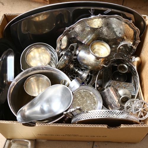 1028 - A large collection of mixed plated ware, to include candelabra, serving trays, cruets, ice bucket, s... 