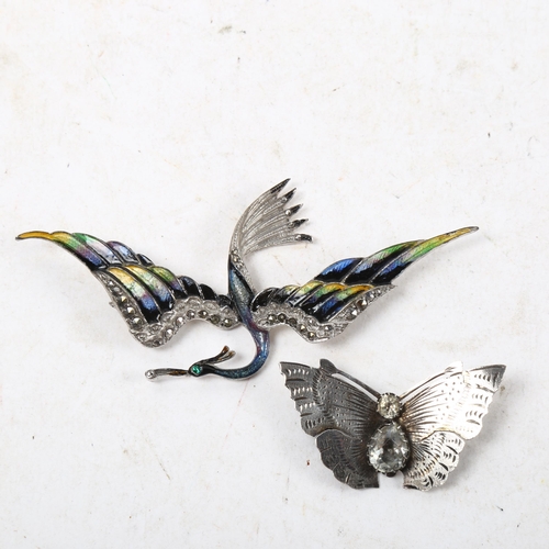 1061 - A silver and stone set butterfly design brooch, and a Continental silver and enamel swallow design b... 