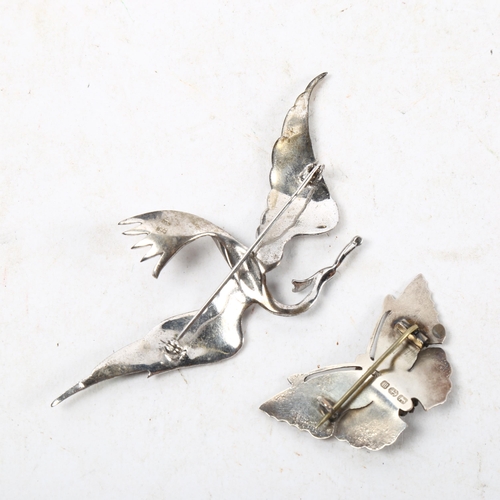 1061 - A silver and stone set butterfly design brooch, and a Continental silver and enamel swallow design b... 