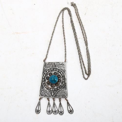 1067 - A silver filigree and turquoise set panel pendant necklace and chain