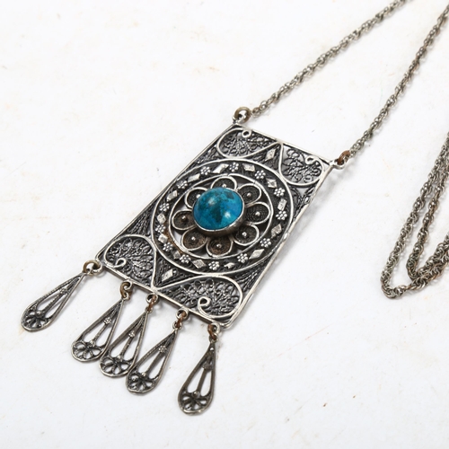 1067 - A silver filigree and turquoise set panel pendant necklace and chain