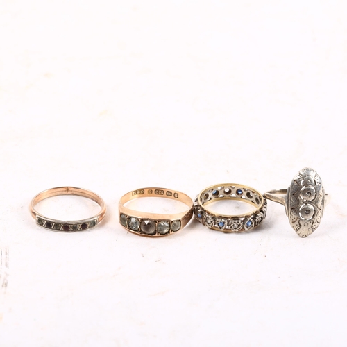 1070 - A 9ct gold stone set ring, an eternity ring, and 2 others