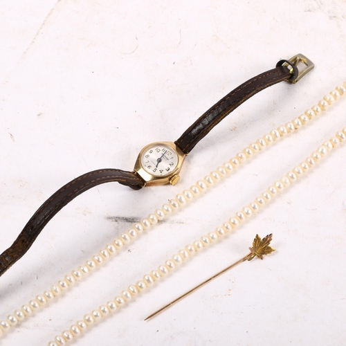 1075 - A lady's Waltham 9ct gold-cased wristwatch, a 10ct gold stick pin, and a pearl choker necklace with ... 