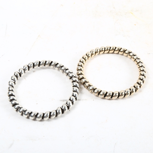 1080 - 2 silver spring design bangles, both marked 830s