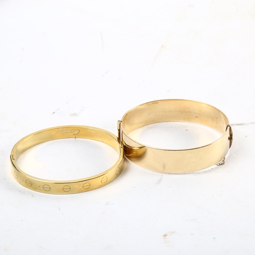 1081 - A 9ct rolled gold engraved bangle, and a gilded bangle