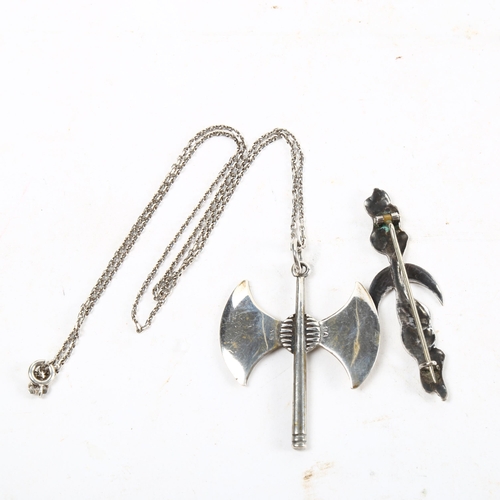 1084 - A sterling silver pendant and chain in the form of a Viking axe, and a Viking style silver brooch (2... 