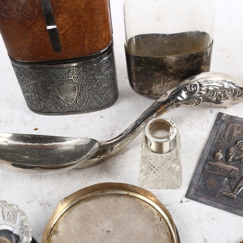 1088 - 2 hip flasks, 1 leather-covered, a tavern scene plaque, an Eastern white metal serving spoon etc