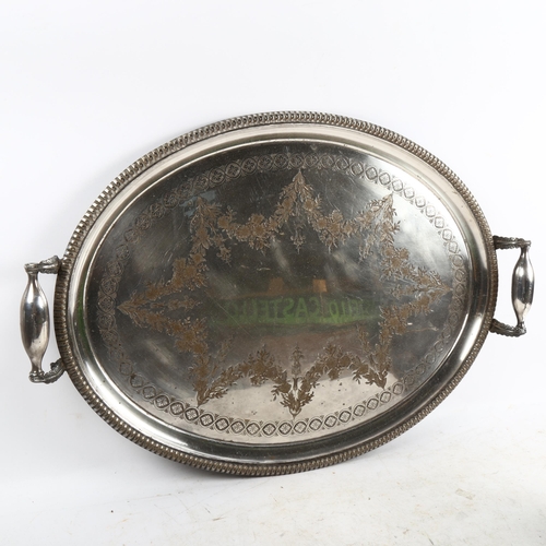 1089 - A Victorian silver plated oval 2-handled tea tray, with engraved decoration, width 63cm