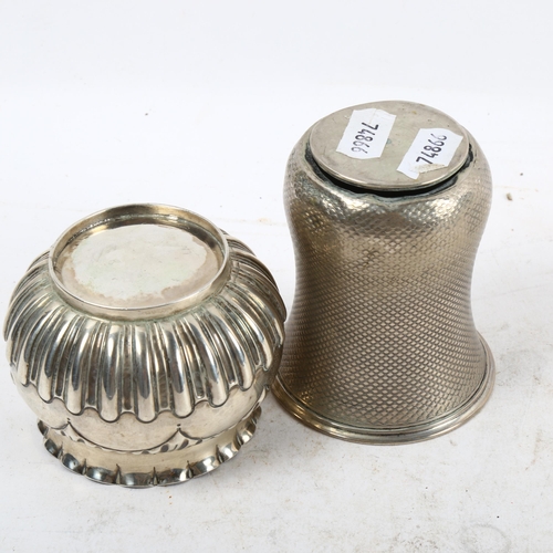 1101 - An embossed silver bowl, and an engine turned silver beaker (2)