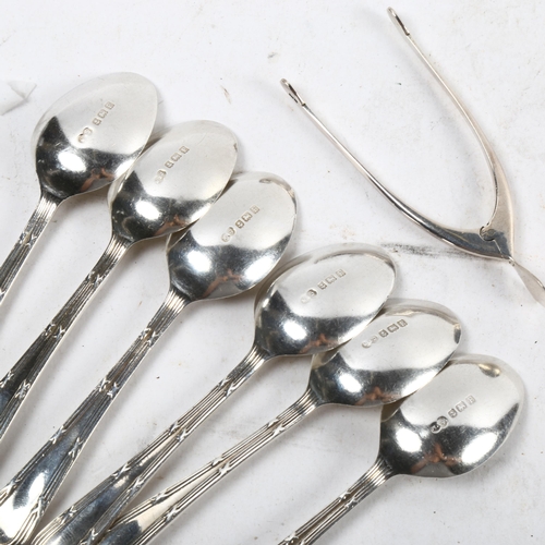 1102 - A set of 6 silver coffee spoons, and a pair of silver wishbone sugar nips