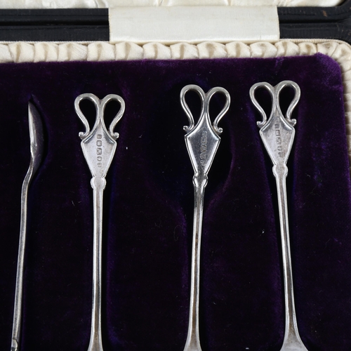 1103 - A cased set of Art Nouveau silver plated teaspoons and matching tongs, maker's marks for Lews