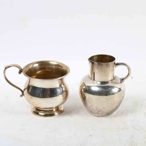 1105 - A small silver Jersey cream can, and a small silver cup (2)