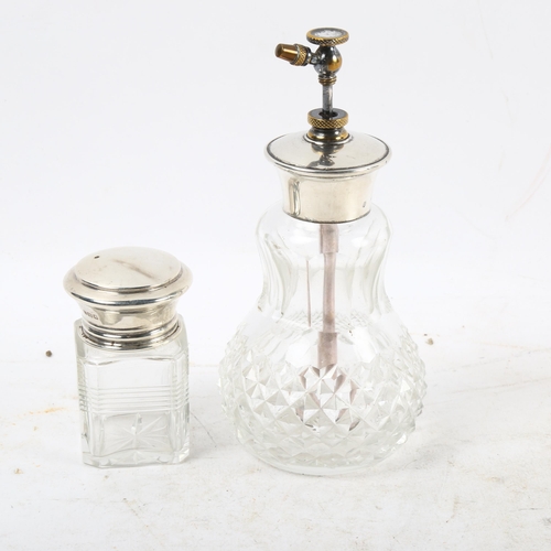 1107 - A glass and sterling silver-mounted atomiser, and a silver-topped dressing table bottle (2)