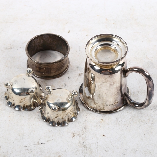 1111 - A pair of miniature silver salts, a silver napkin ring, and a small silver tankard