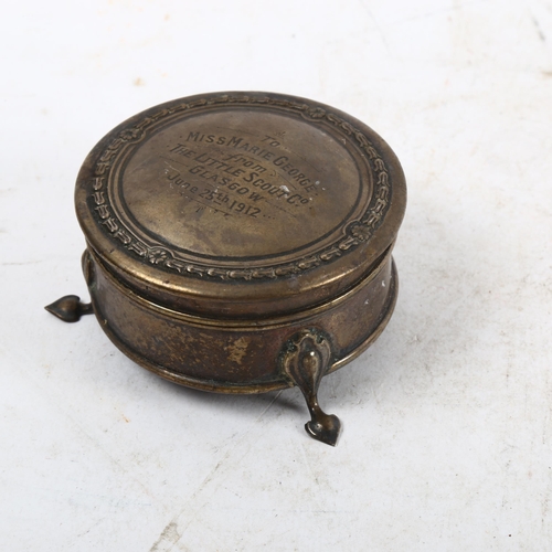 1114 - An early 20th century circular silver trinket box, with presentation inscription