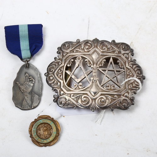 1118 - An Elizabeth II silver Masonic nurses buckle, Birmingham 1982, maker's mark for Toye, Kenning & Spen... 