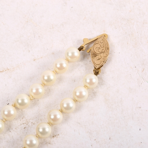 1125 - A freshwater pearl necklace, with engraved 9ct gold clasp, overall length 53cm