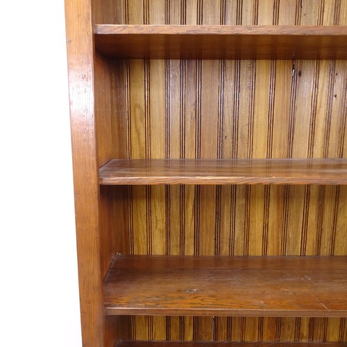 2399 - A large oak open bookcase with 6 fixed shelves, 125cm x 230cm x 40cm