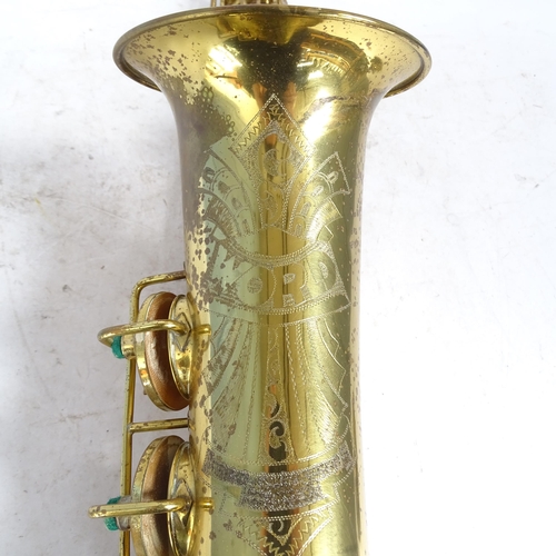 258 - A brass lacquered World saxophone, serial no. 24561, in hardshell case