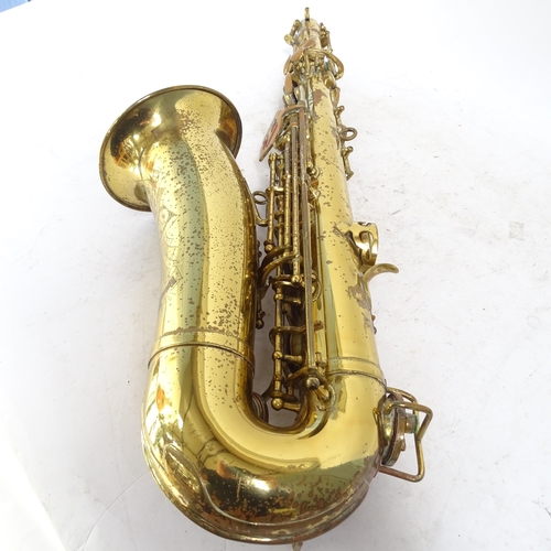 258 - A brass lacquered World saxophone, serial no. 24561, in hardshell case