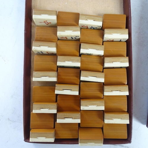 367 - A Chad Valley Mahjong bone and bamboo set, cased with stands