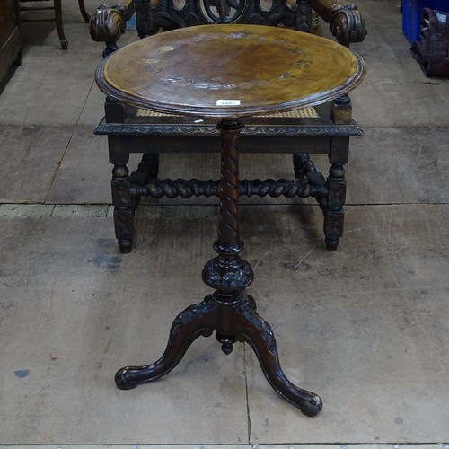 2401 - A Victorian walnut circular topped wine table on tripod base, 51cm x 72cm