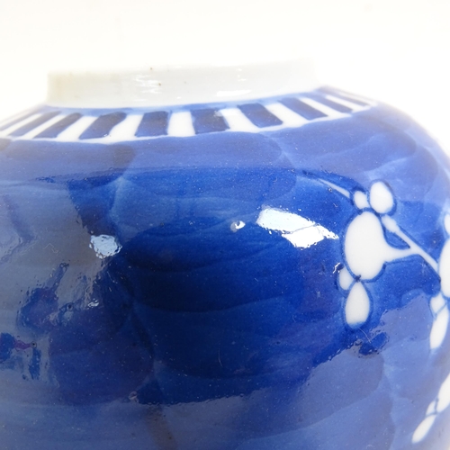 202 - 2 Chinese blue and white Prunus pattern ginger jars, height 14cm