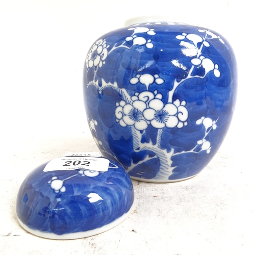 202 - 2 Chinese blue and white Prunus pattern ginger jars, height 14cm