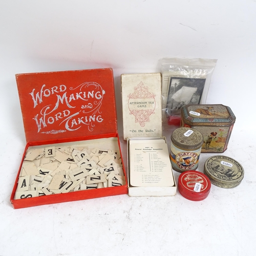 496 - A large selection of Vintage board games, and Vintage advertising tins, including Player's Navy Cut ... 